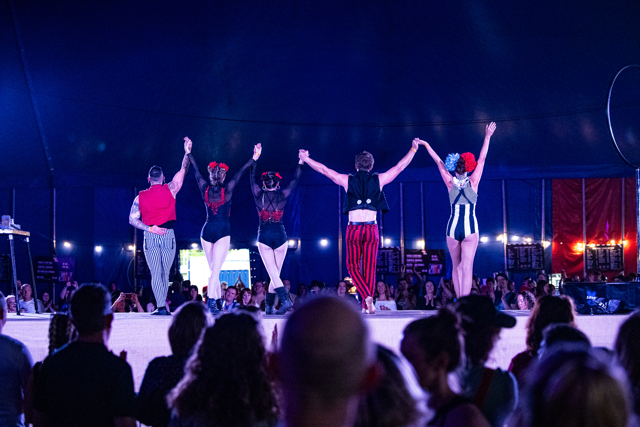 The circus performers taking a bow on the Rock N Roll Circus stage